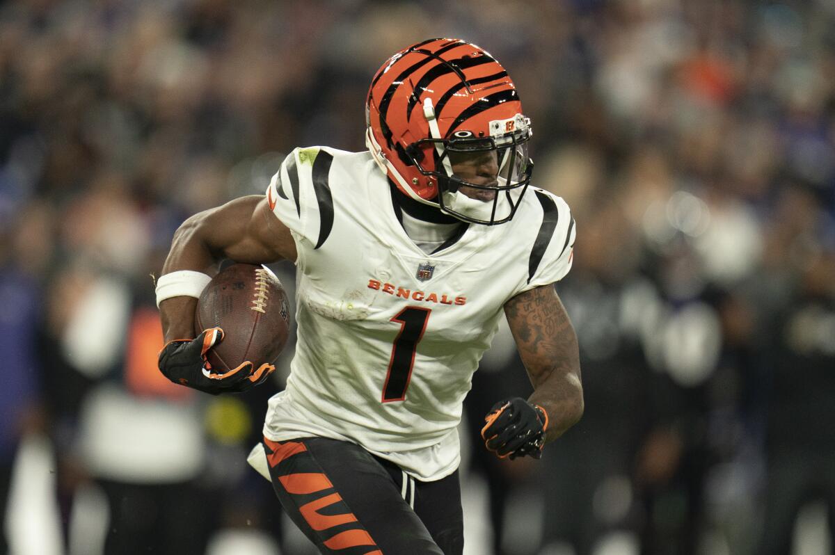 Cincinnati Bengals wide receiver Ja'Marr Chase runs with the ball against the Baltimore Ravens.