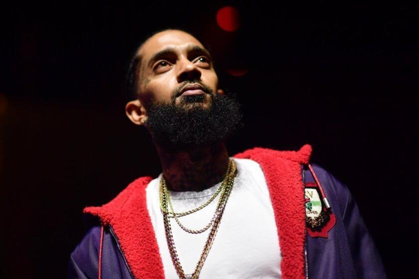 Rapper Nipsey Hussle was shot after getting into a conversation with his alleged killer over snitching, according to grand jury documents released on Thursday.