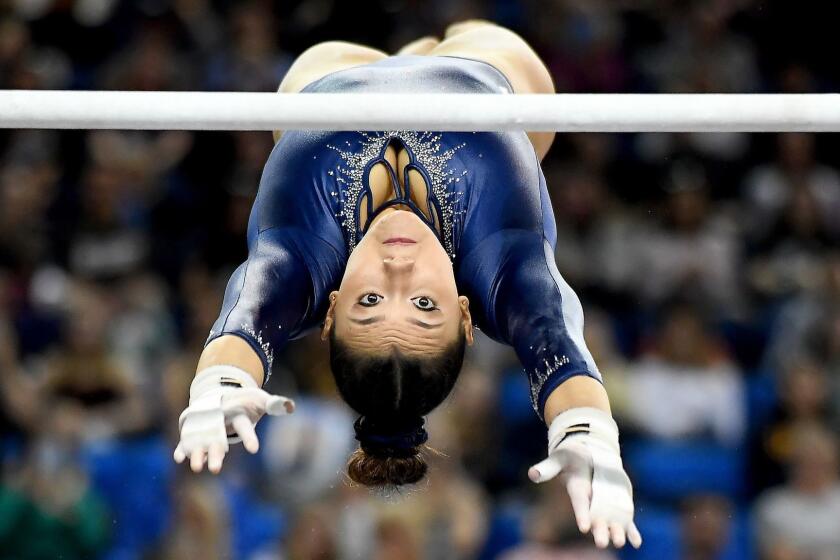 LOS ANGELES, CALIFORNIA MARCH 10, 2019-Kyla Ross competes on the uneven bars against Stanford at Pauley Pavillion Sunday. (Wally Skalij/Los Angeles Times)