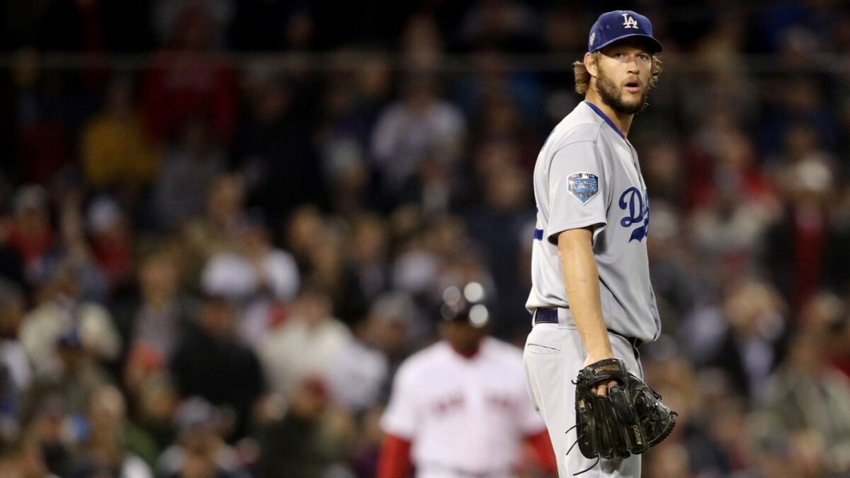 The Dodgers' Clayton Kershaw reacts against the Boston Red Sox in Game One of the 2018 World Series at Fenway Park on October 23, 2018 in Boston, Massachusetts.
