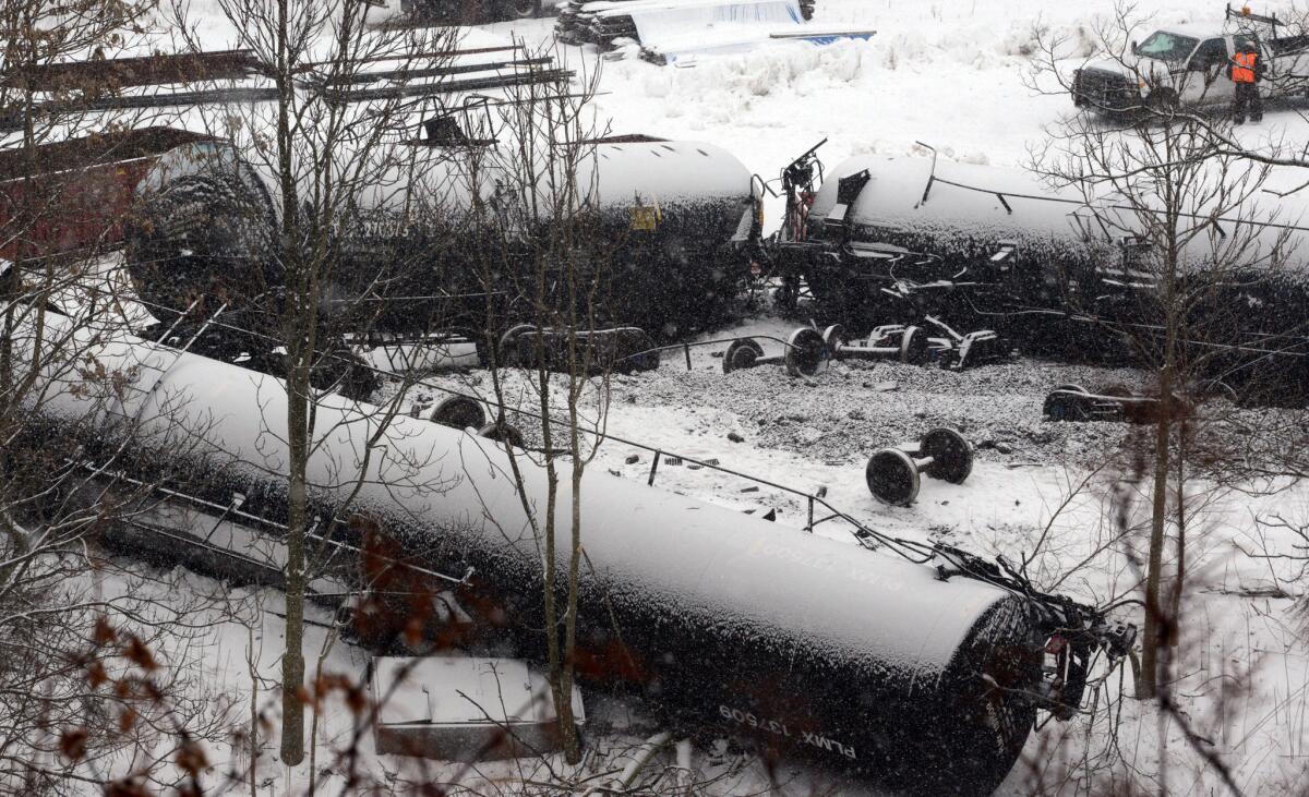 Cars are seen from a freight train derailment on Feb. 13, 2014, in Vandergrift, Pa.