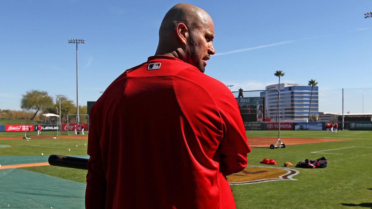 Angels slugger Albert Pujols says he doesn't feel 100% yet after foot surgery in December. (Gary Coronado / Los Angeles Times)