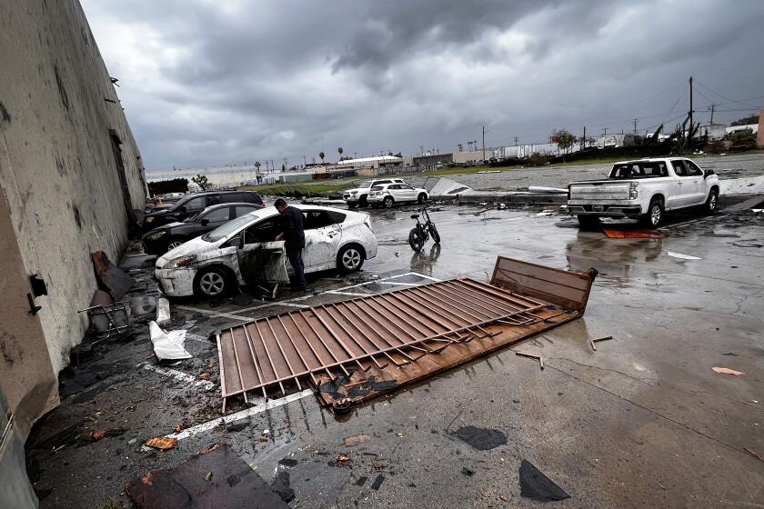 MONTEBELLO CA MARCH 22, 2022 - Debris is strewn about outside The Royal Paper Box Company in Montebello, after a possible tornado ripped the roof off their building Wednesday afternoon, March 22, 2023. (Allen J. Schaben / Los Angeles Times)