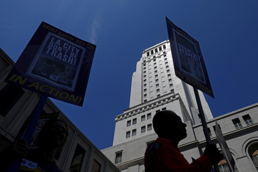 LOS ANGELES, CA - AUGUST 08: Los Angeles city workers, who are staging a one-day walkout to protest what they say are unfair labor practices by the city, gather at City Hall in downtown on Tuesday, Aug. 8, 2023 in Los Angeles, CA. Thousands of Los Angeles city workers hit the picket lines Tuesday for a massive one-day strike after union leaders accused the city of unfair labor practices, which Mayor Karen Bass and other officials denied. (Gary Coronado / Los Angeles Times)