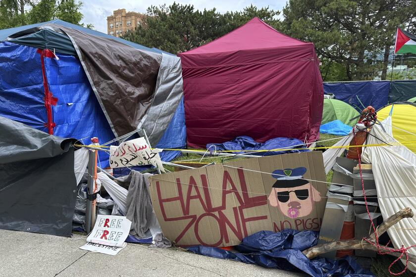 A pro-Palestinian encampment is shown Tuesday, May 28, 2024, on the campus of Wayne State University in Detroit. The school suspended in-person classes and encouraged staff to work remotely to avoid any problems with the encampment. (AP Photo/Mike Householder)