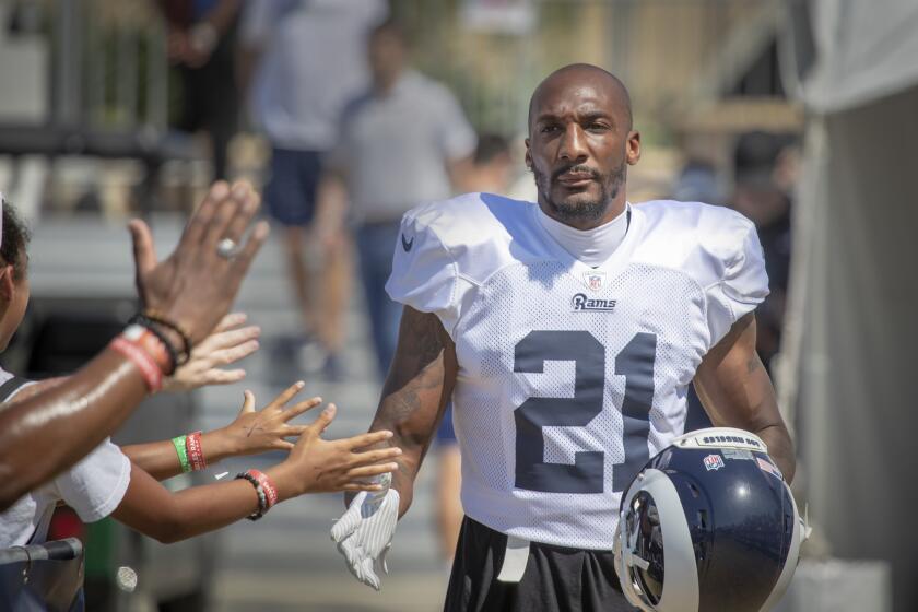 IRVINE, CALIF. -- MONDAY, AUGUST 13, 2018: Rams cornerback Aqib Talib greets fans as he attends the Los Angeles Rams training camp at UC-Irvine in Irvine, Calif., on Aug. 13, 2018. (Allen J. Schaben / Los Angeles Times)