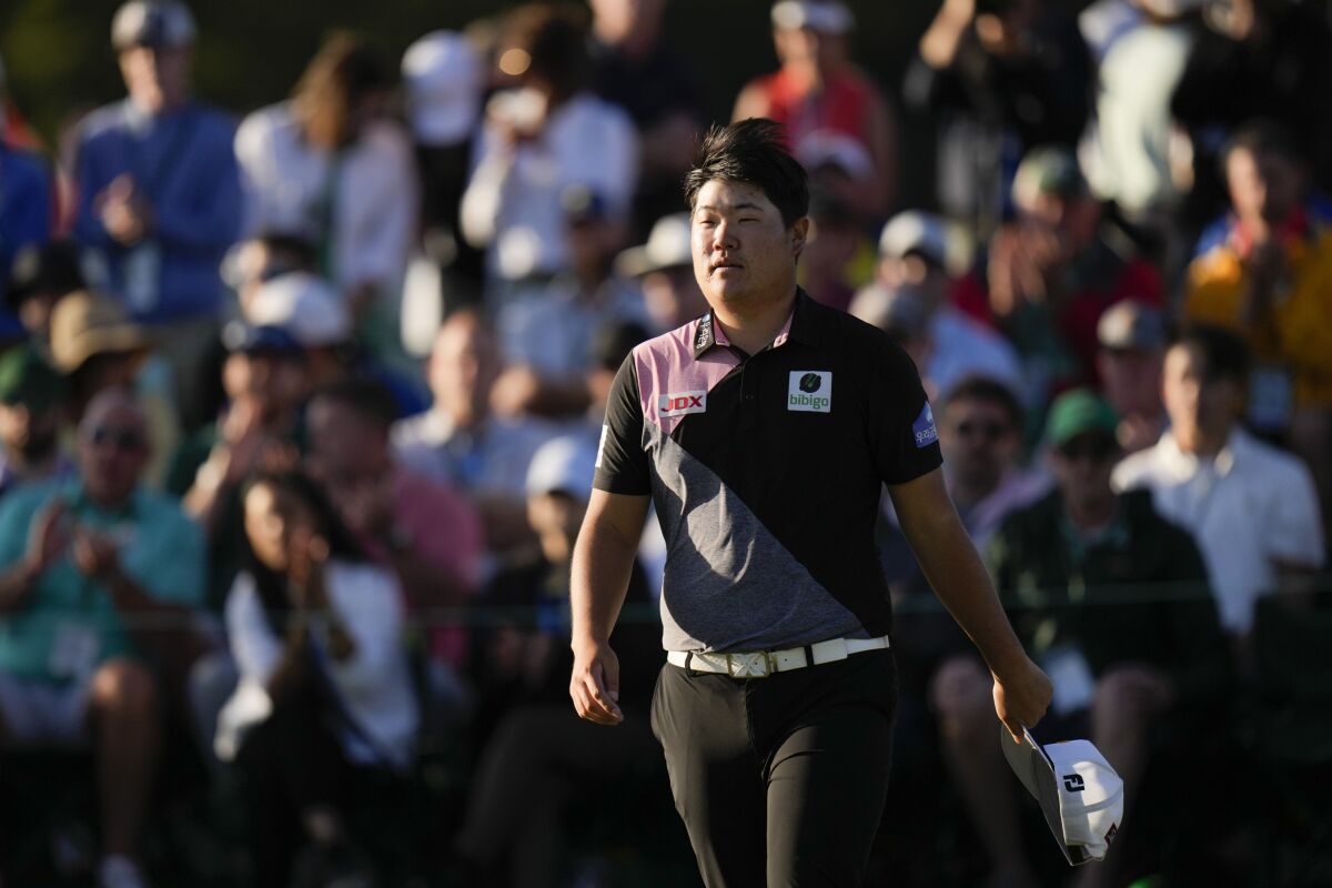 Sungjae Im, of South Korea, on the 18th green following the first round at the Masters golf tournament on Thursday, April 7, 2022, in Augusta, Ga. (AP Photo/Jae C. Hong)