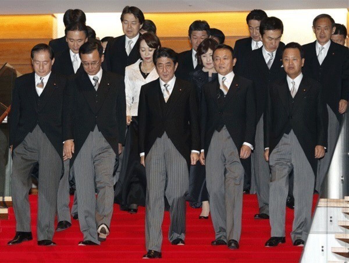 Prime Minister Shinzo Abe with his new Cabinet.