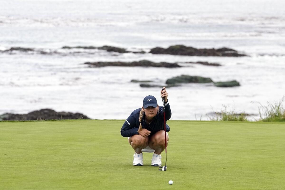 Bailey Tardy squats down and measures her putt on the ninth green during the second round of the U.S. Women's Open