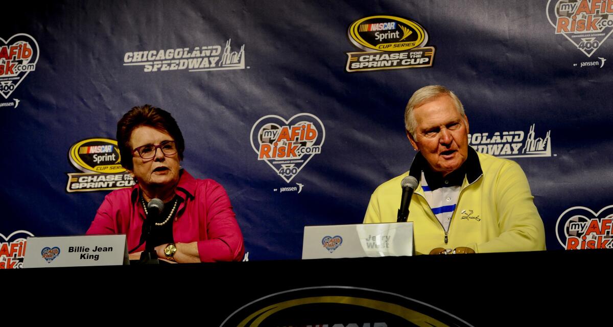 Grand Marshall's Billie Jean King, left, a tennis champion, and former NBA player Jerry West speak to the media before the NASCAR Sprint Cup Series auto race at Chicagoland Speedway, Sunday, Sept. 20, 2015, in Joliet, Ill. (AP Photo/Matt Marton)