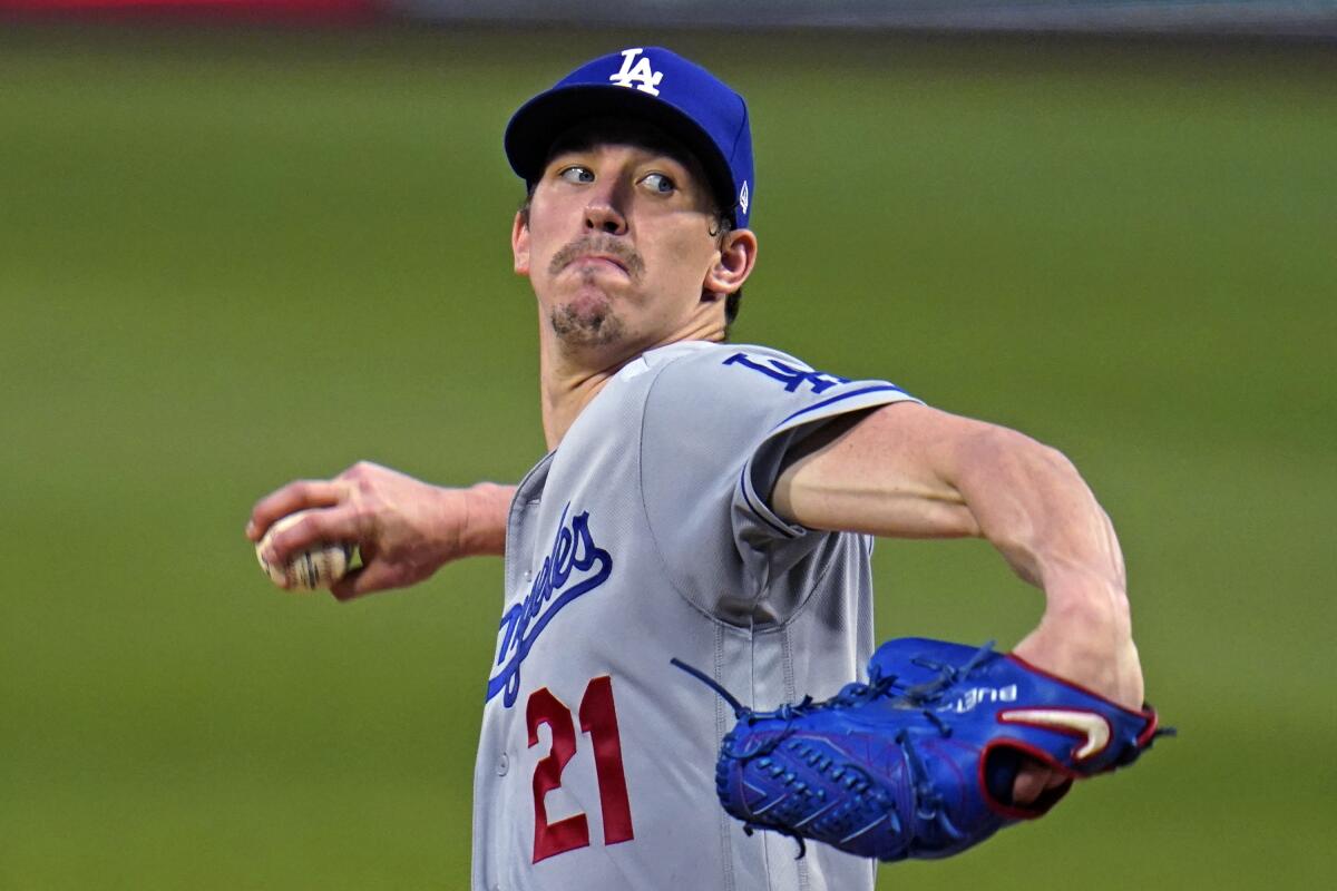 Dodgers pitcher Walker Buehler winds up during the third inning against the Pittsburgh Pirates.