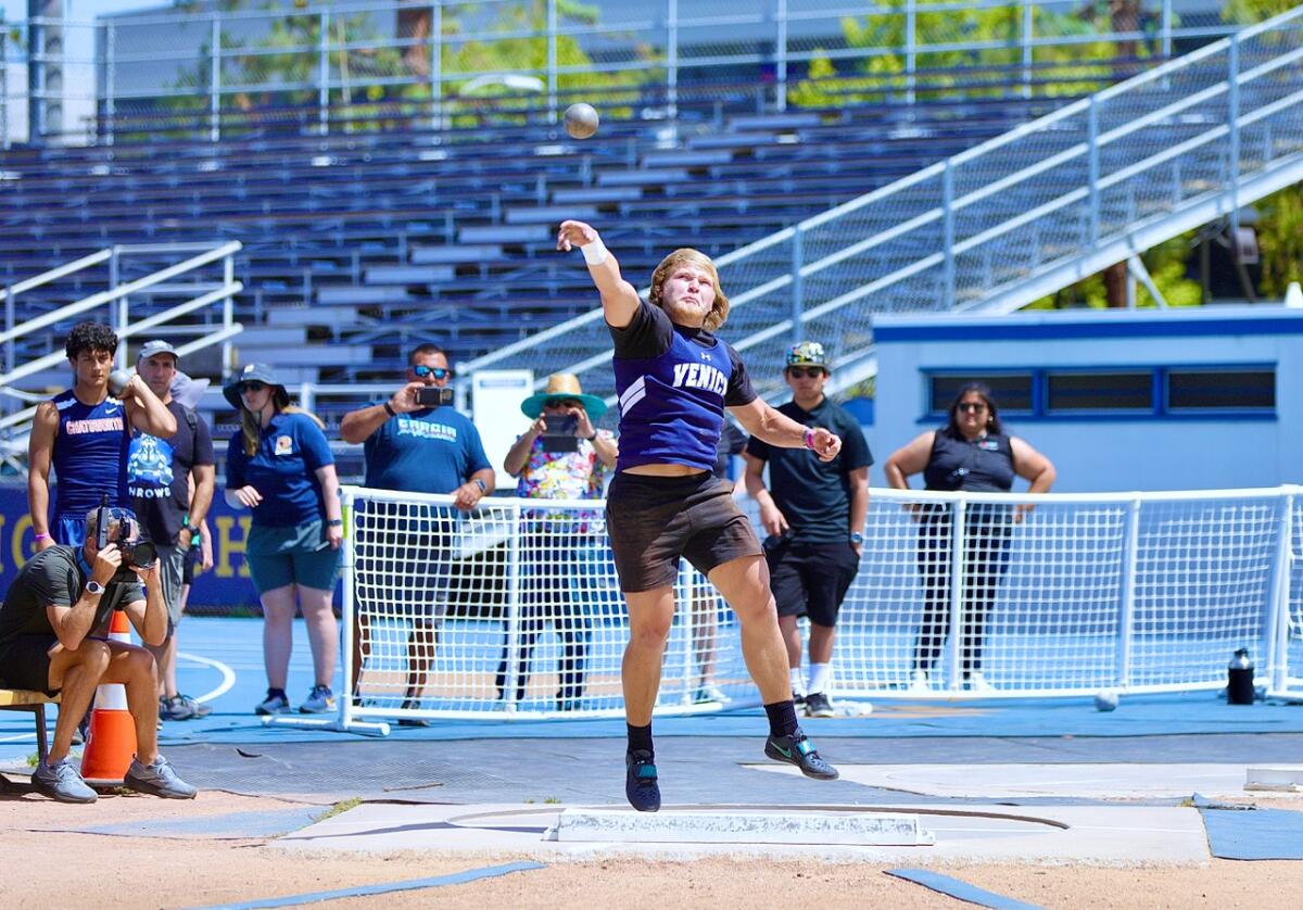 Venice’s Lawrence Kensinger wins the shotput with a throw of 55 feet.