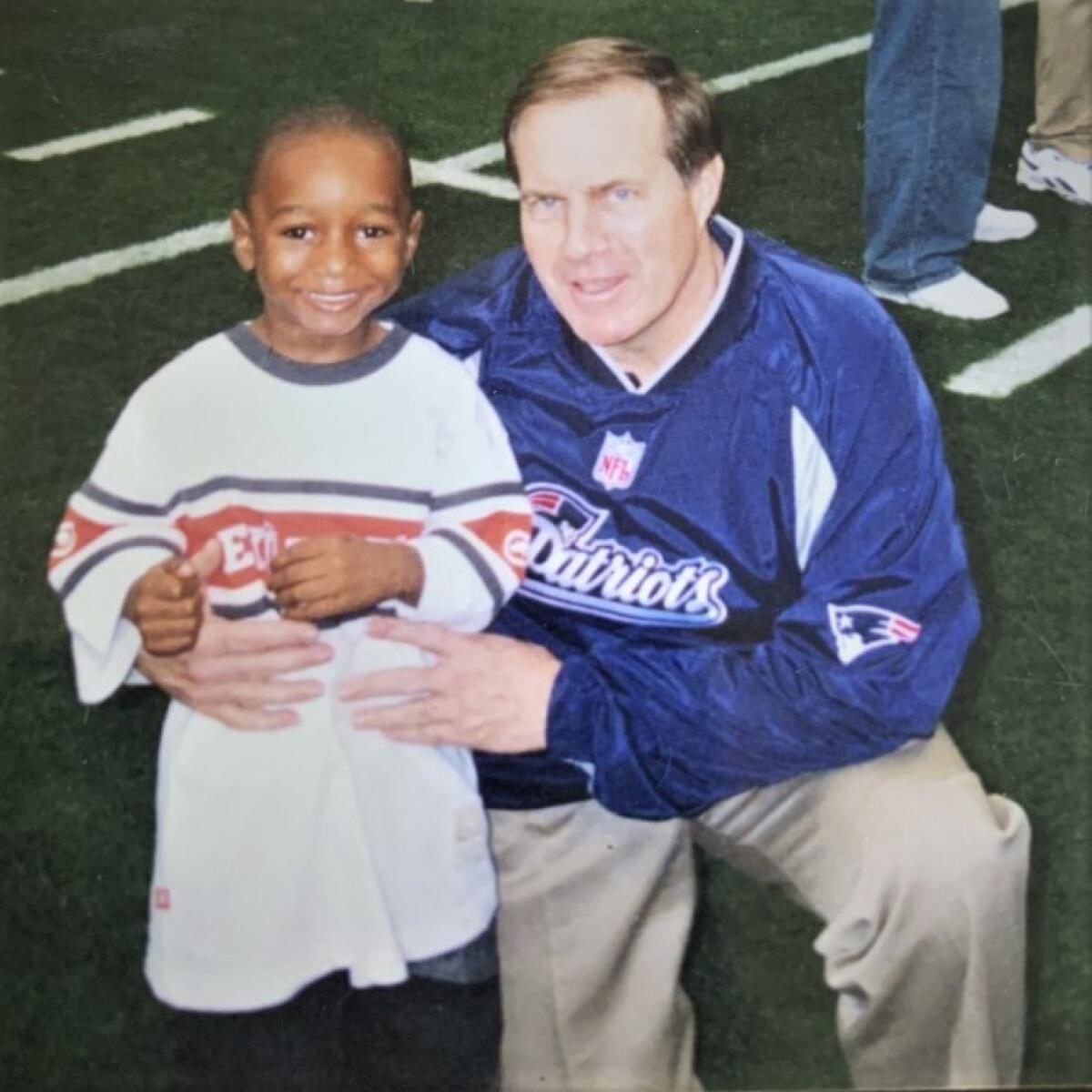 Asante Samuel Jr. with New England coach Bill Belichik when Samuel Sr. was a member of the Patriots in the mid-2000s.