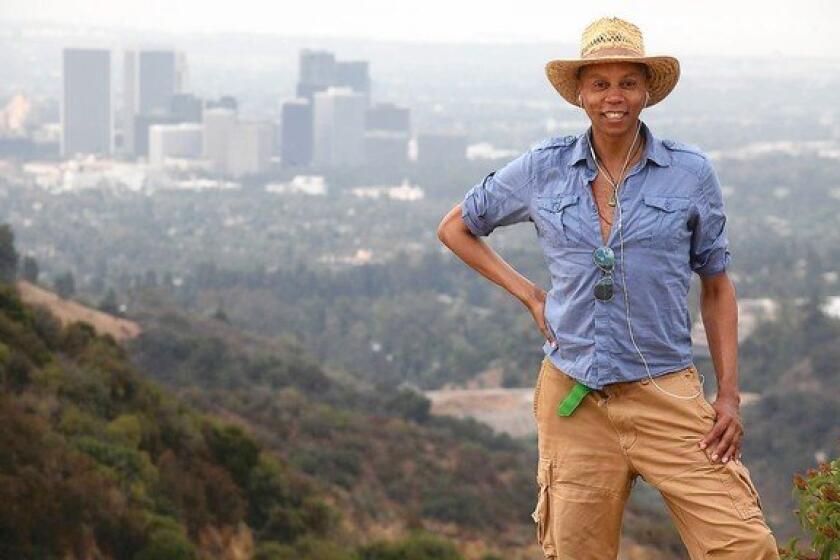 RuPaul takes a short break during hiking in Franklin Canyon Park in Los Angeles.
