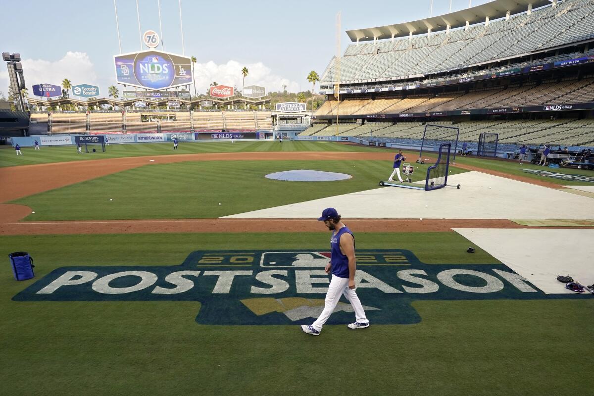 Los Angeles Dodgers' Clayton Kershaw walks on the field during baseball practice Monday, Oct. 10, 2022, in Los Angeles for the National League division series against the San Diego Padres. (AP Photo/Mark J. Terrill)