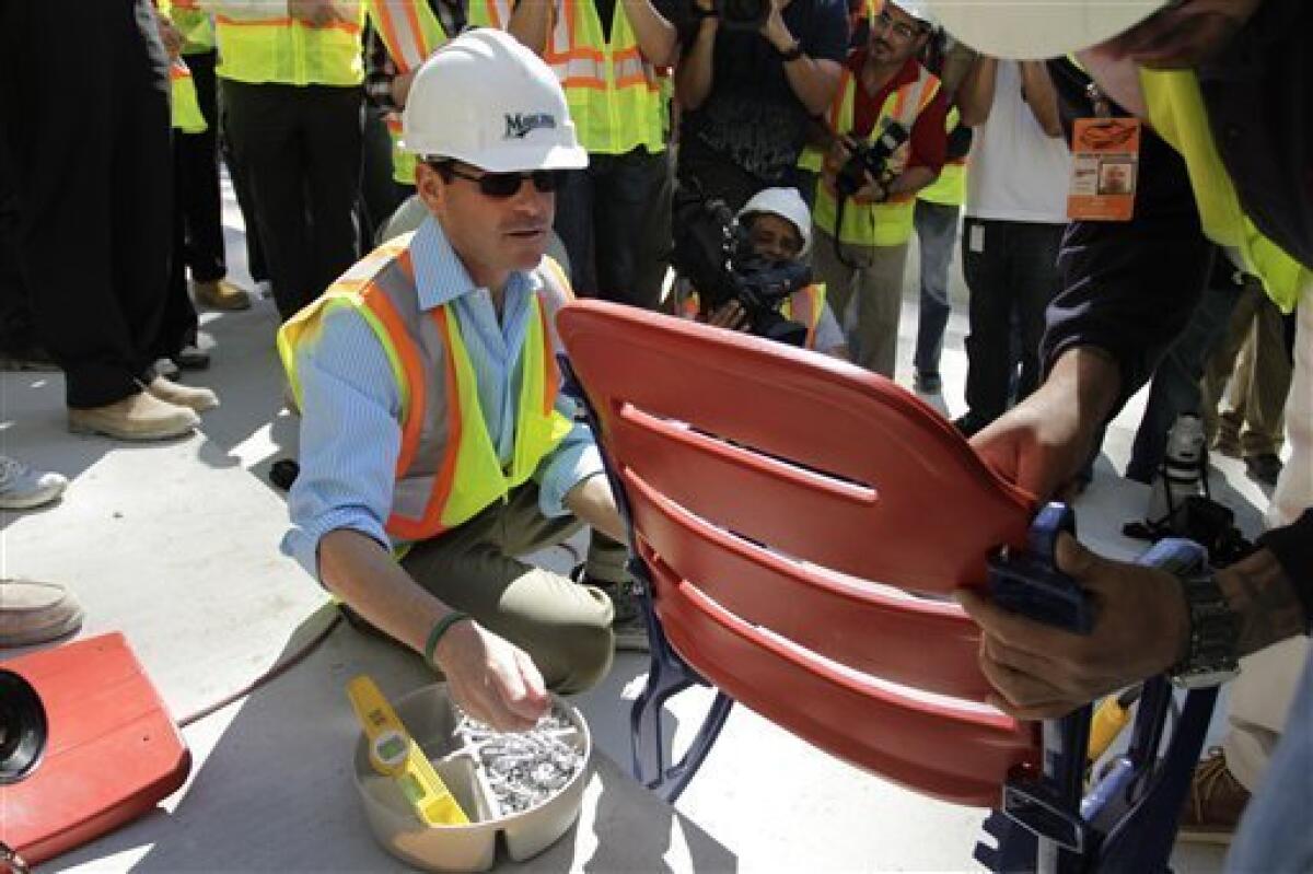 Marlins install 1st seat at new Miami ballpark - The San Diego