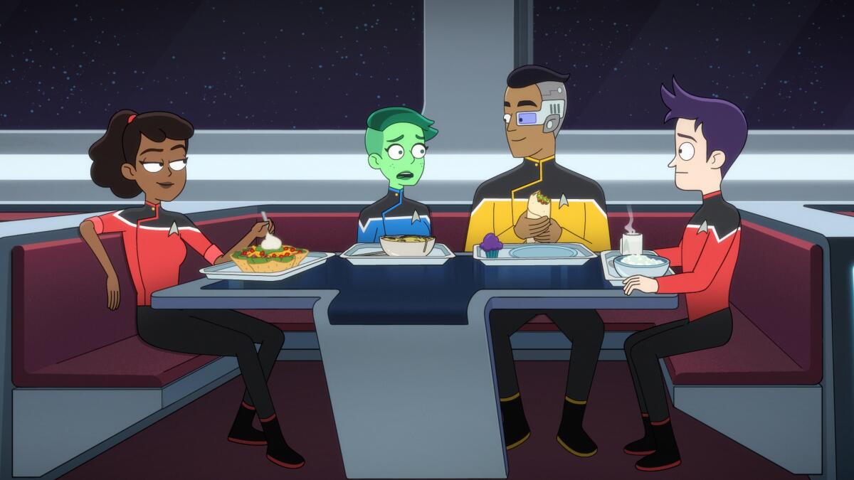 Four animated "Star Trek" figures sitting around a cafeteria table