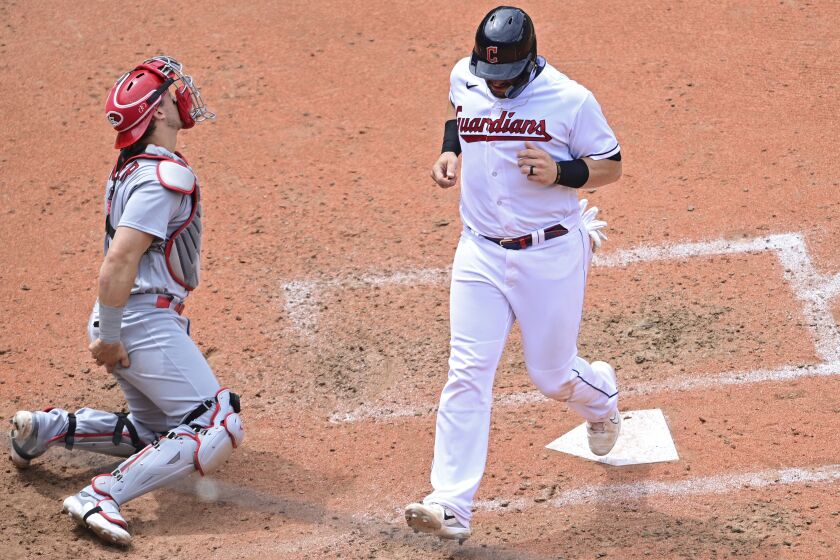 Cleveland Guardians' Mike Zunino scores a run on a double by Steven Kwan during the fifth inning of a baseball game against the St. Louis Cardinals, Sunday, May 28, 2023, in Cleveland. (AP Photo/David Dermer)