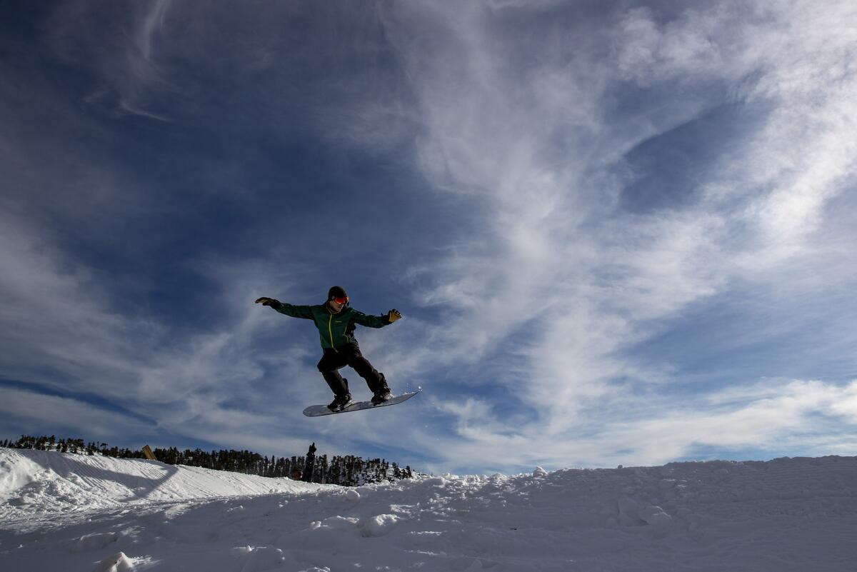A snowboarder gets some air on a Mt. Baldy slope