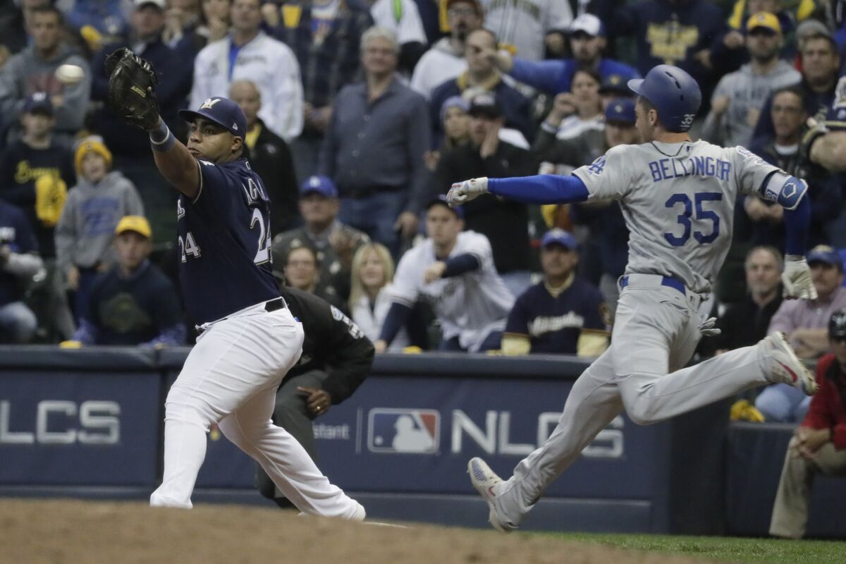 Dodgers center fielder Cody Bellinger is thrown out by a hair on a grounder during Game 1 of the NLCS on Friday.