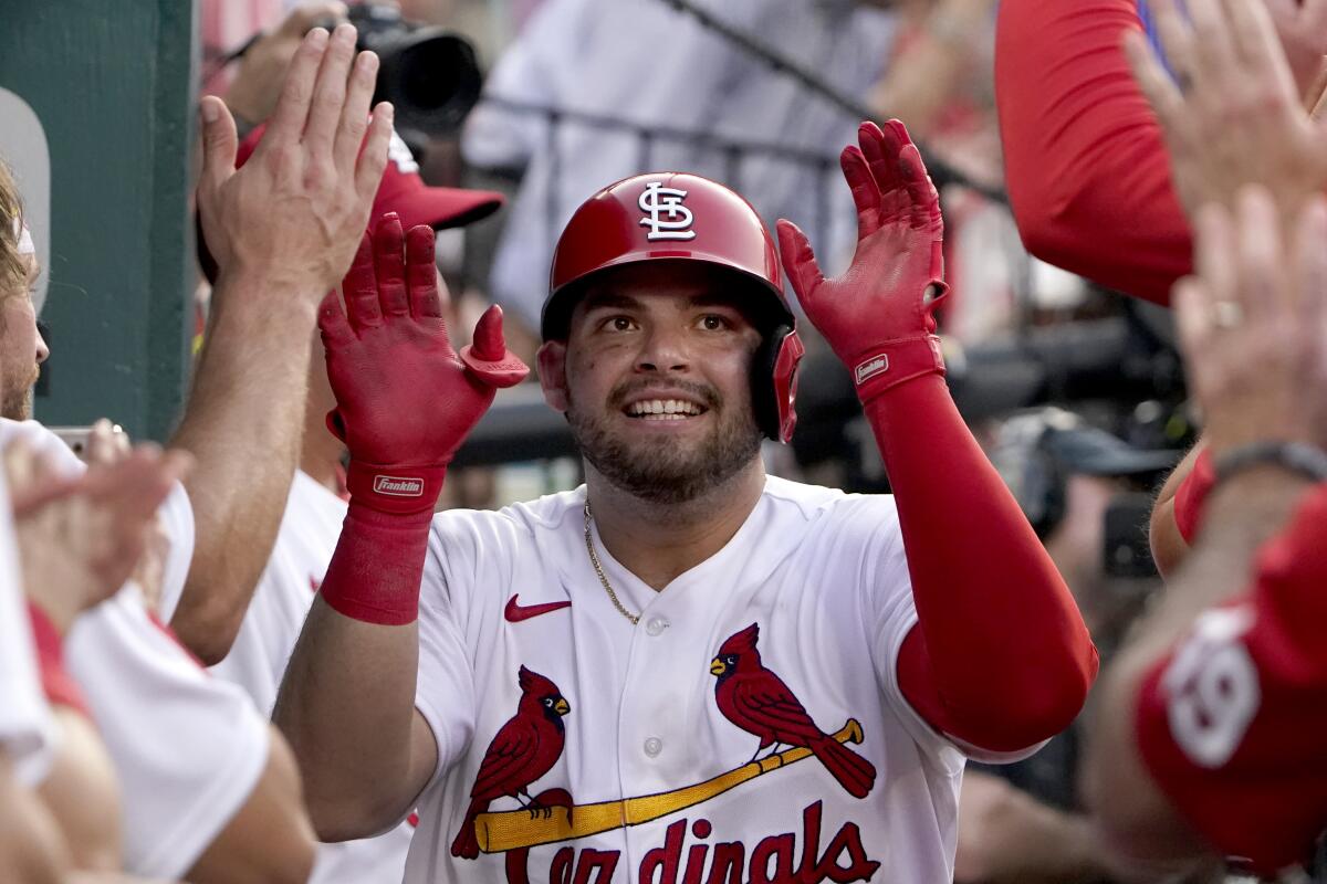 St. Louis Cardinals' Juan Yepez is congratulated by teammates after hitting a solo home run during the second inning of a baseball game against the Baltimore Orioles Wednesday, May 11, 2022, in St. Louis. (AP Photo/Jeff Roberson)