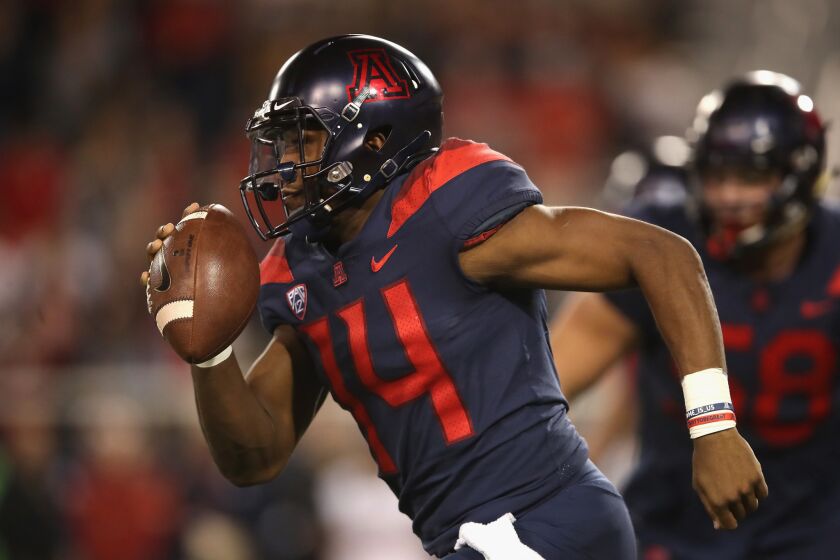 TUCSON, AZ - NOVEMBER 02: Quarterback Khalil Tate #14 of the Arizona Wildcats scrambles with the football against the Colorado Buffaloes during the second half of the college football game at Arizona Stadium on November 2, 2018 in Tucson, Arizona. (Photo by Christian Petersen/Getty Images) ** OUTS - ELSENT, FPG, CM - OUTS * NM, PH, VA if sourced by CT, LA or MoD **