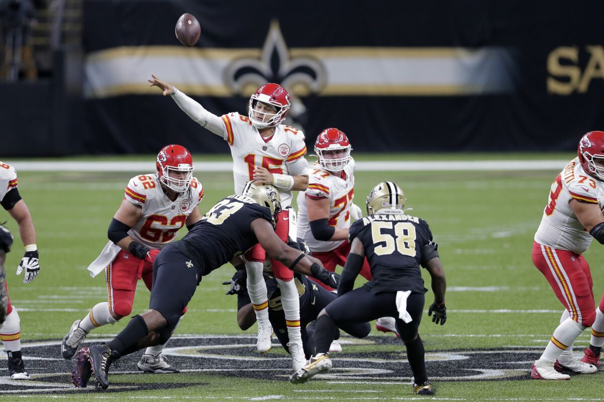 Kansas City Chiefs quarterback Patrick Mahomes is hit by New Orleans Saints defensive tackle David Onyemata.