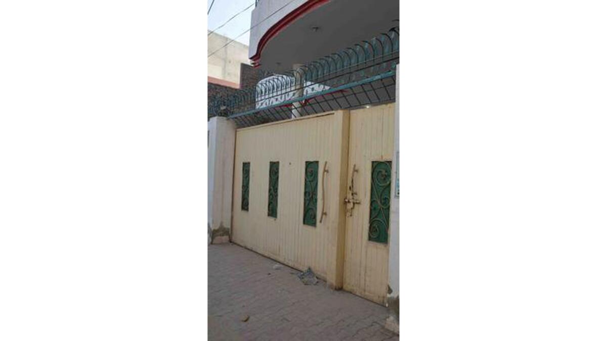 An exterior view of the house of Gulzar Ahmed Malik, the father of Tashfeen Malik, the woman involved in the killing of 14 people during a siege in California, where she reportedly stayed during her studies as a pharamcy student at the Bahauddin Zakariya University, in Multan, Pakistan, taken on Sunday.