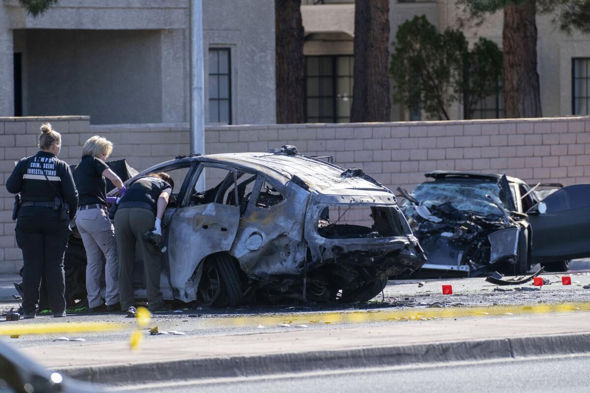 Las Vegas police investigators work at the scene of a fatal crash involving Henry Ruggs III on Tuesday.