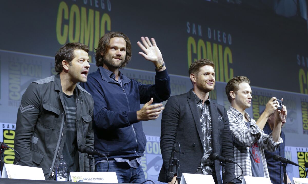 "Supernatural" cast members Misha Collins, Jared Padalecki, Jensen Ackles and Alex Calvert greet fans during Comic-Con 2018.