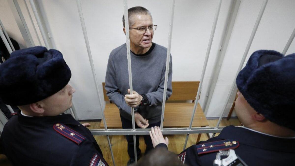 Former Russian Economic Development Minister Alexei Ulyukayev speaks from behind bars after a verdict announcement at a court in Moscow on Dec. 15, 2017.