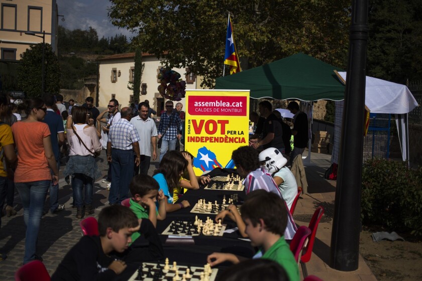 In Caldes de Montbui, Spain, near Barcelona, pro-independence advocates collect signatures on the sidelines of a youth chess tournament in support of asking the regional legislature to schedule a vote on whether to separate from Spain.