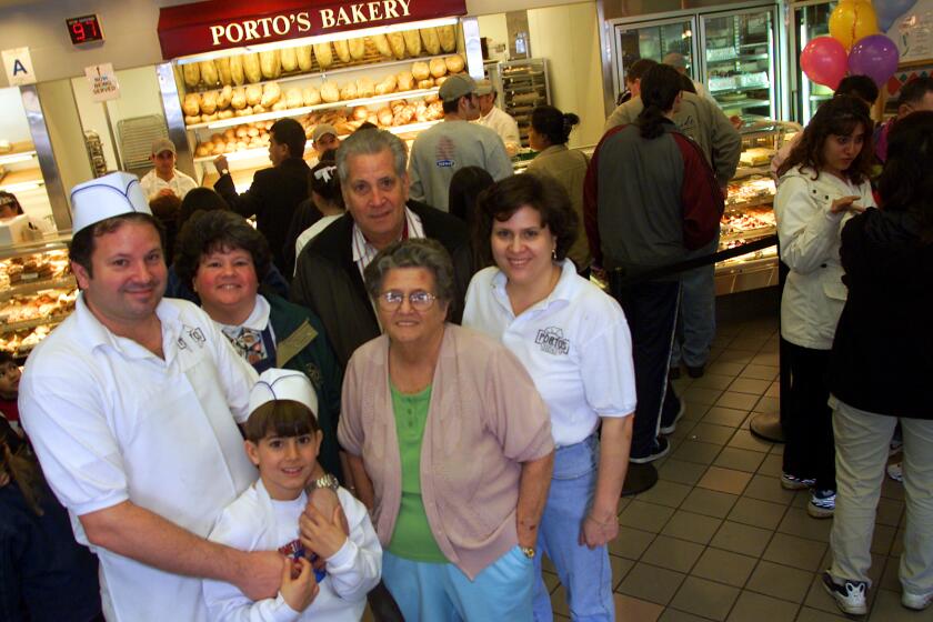 The Porto family at their Glendale store in a photo from 2001. From left to right: Raul Porto, Jr. and his son Adrian, Betty Porto, Raul Porto, Sr., Rosa Porto, and Margarita Navarro. Rosa Porto died Friday at the age of 89.