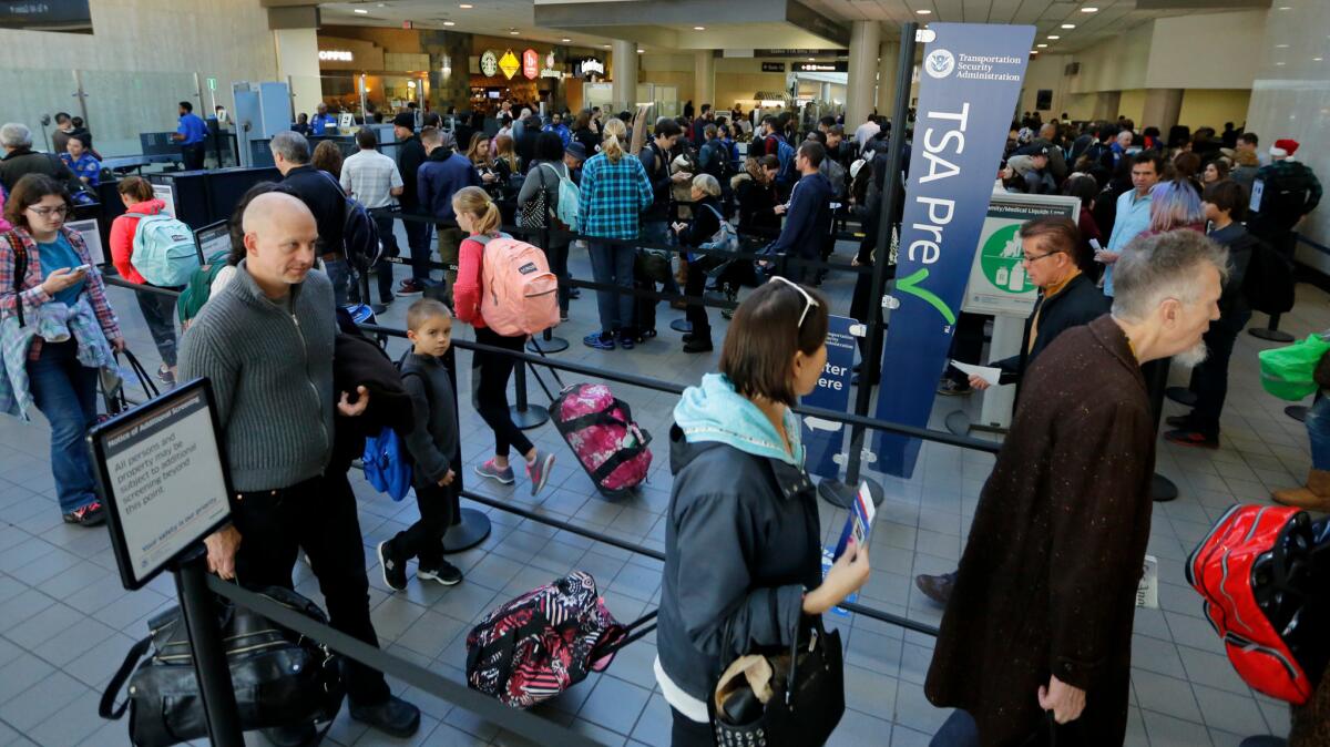 Passengers snake their way through the security lines in Terminal 1 at Los Angeles International Airport in December.
