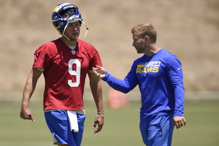 The Rams' Matthew Stafford talks with coach Sean McVay after a practice in Thousand Oaks, Calif., on May 27, 2021.