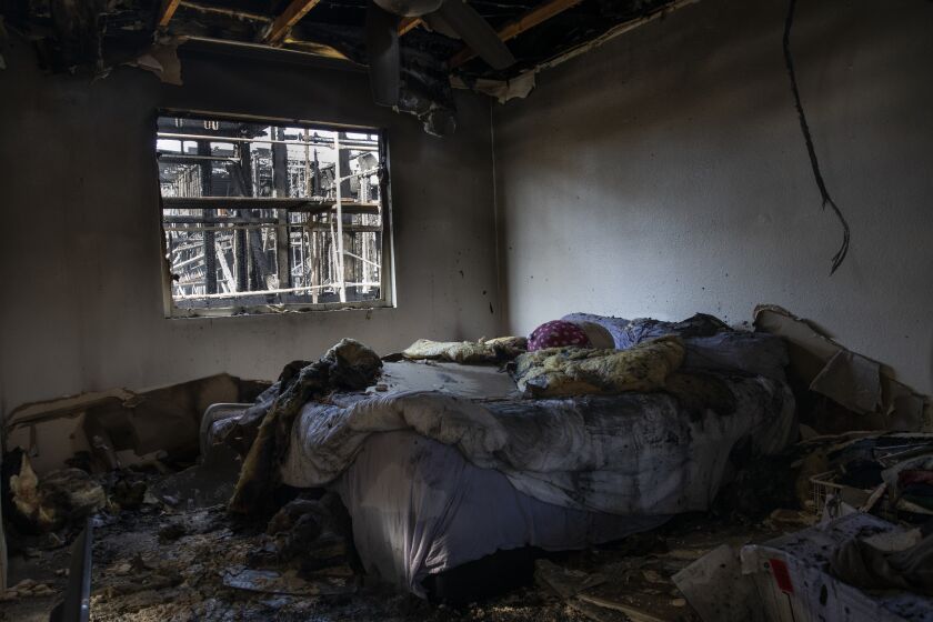 San Diego, California - December 25: A bedroom of a rental unit after a two-story building that was under construction caught fire around 1 a.m. Sunday on Hornblend Street, near Jewell Street in Pacific Beach in San Diego, California. The fire damaged three adjacent rental units and melted nearby cars. (Ana Ramirez / The San Diego Union-Tribune)