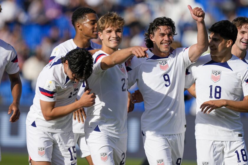 Rokas Pukstas, second from left, of the United States is congratulated after scoring his side's 4th goal against New Zealand during a FIFA U-20 World Cup round of 16 soccer match at the Malvinas Argentinas stadium in Mendoza, Argentina, Tuesday, May 30, 2023. (AP Photo/Natacha Pisarenko)
