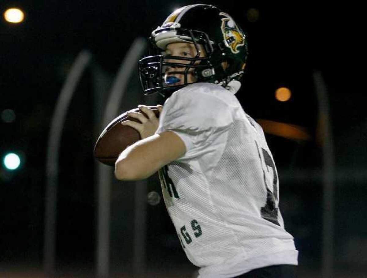 Guy Gibbs of the Burbank Vikings Senior Green prepares for the Youth Super Bowl on Saturday.