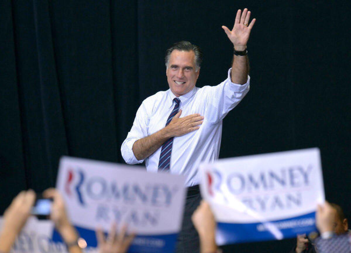 Mitt Romney leads a campaign rally at George Mason University in Fairfax, Va.