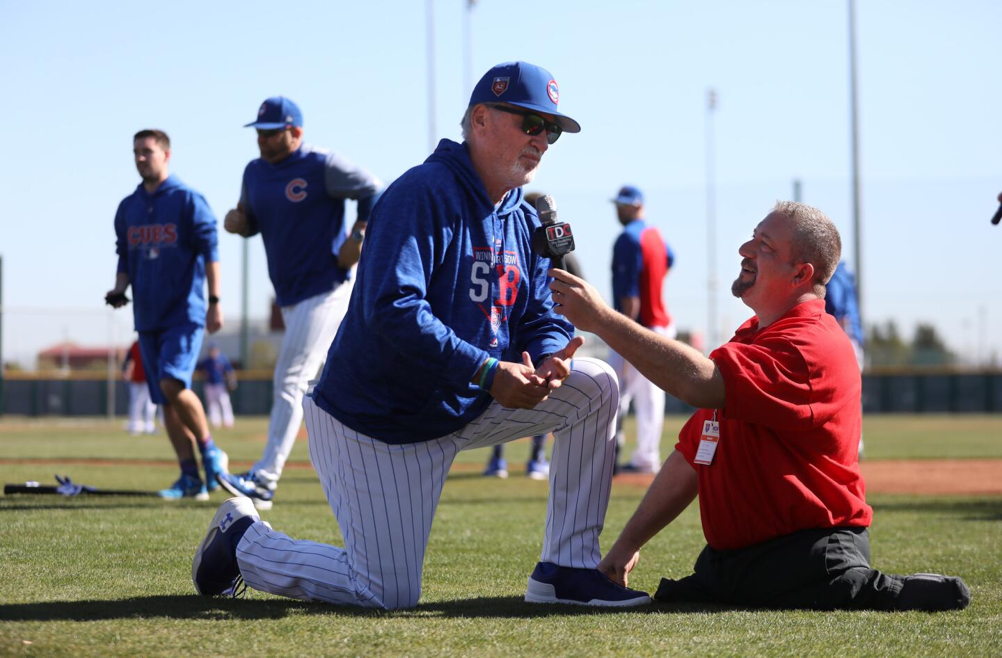 Joe Maddon is interviewed by Dave Stevens of the Disability Network on the practice field in Mesa Arizona on Tuesday Feb. 27, 2018.