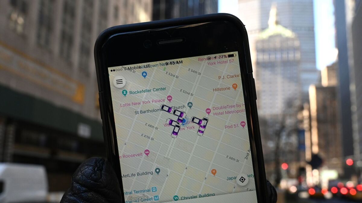 An iPhone with the Lyft ride-sharing app shows cars for hire around Park Avenue in New York City on Tuesday.