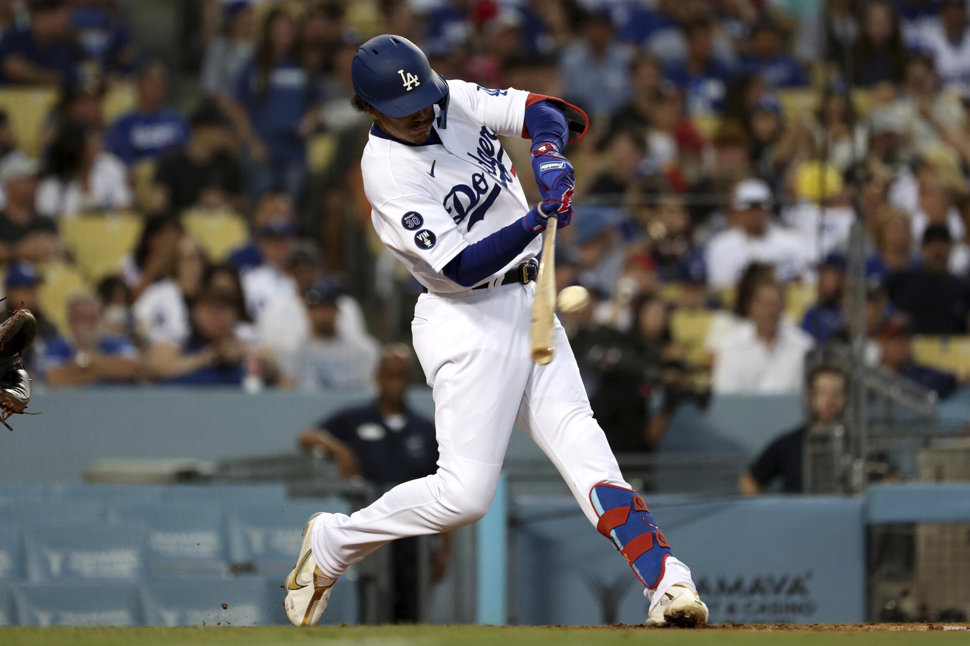 Dodgers first baseman Miguel Vargas hits his first major league home run during the second inning.