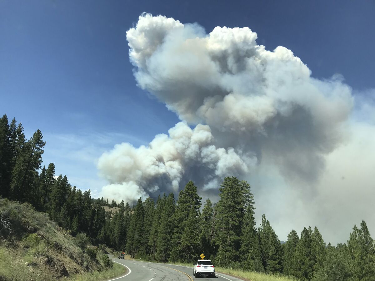 Smoke from the Hog Fire is seen from Highway 36 west of Susanville, California