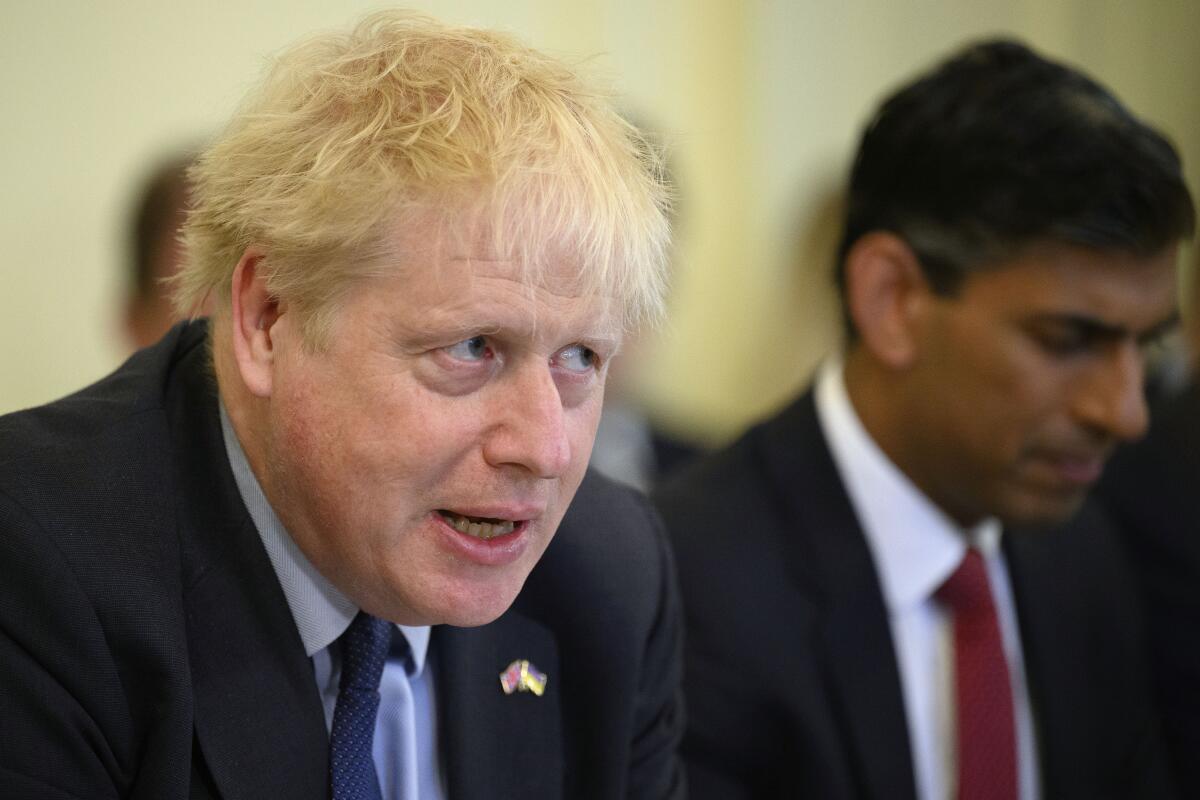 Britain's Prime Minister Boris Johnson addresses his Cabinet during his weekly Cabinet meeting in Downing Street on Tuesday, June 7, 2022 in London. Johnson was meeting his Cabinet and trying to patch up his tattered authority on Tuesday after surviving a no-confidence vote that has left him a severely weakened leader. (Leon Neal/Pool Photo via AP)