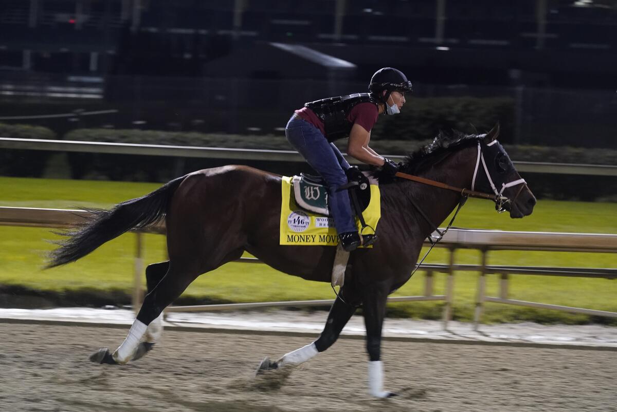 Kentucky Derby entry Money Moves works out at Churchill Downs on Friday.
