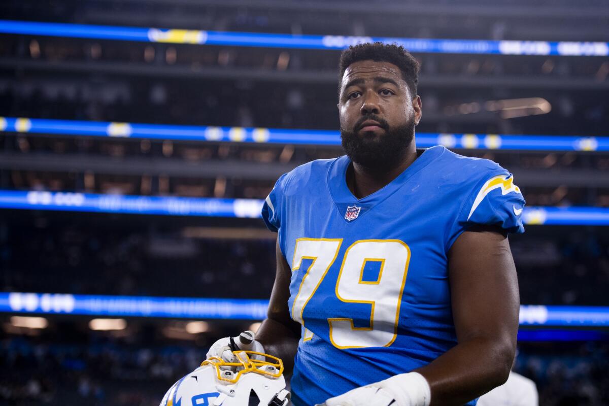  Chargers offensive tackle Trey Pipkins (79) walks off the football field.