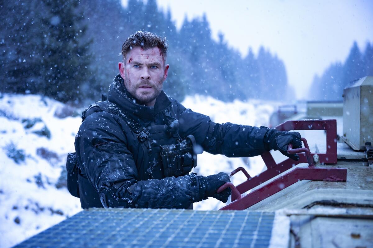 This image released by Netflix shows Chris Hemsworth as Tyler Rake in a scene from the film "Extraction 2." (Jason Boland/Netflix via AP)