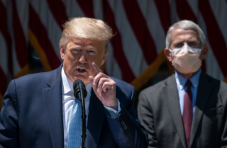 President Trump speaks during a news conference in front of Dr. Anthony Fauci.