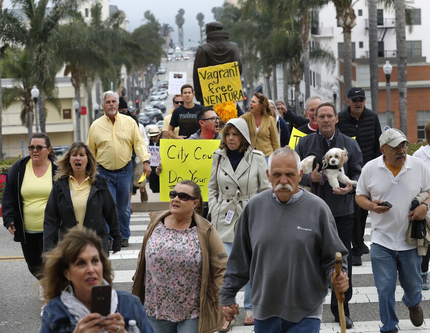 Ventura residents march towards City Hall to voice their concerns over attacks on citizens from homeless people.