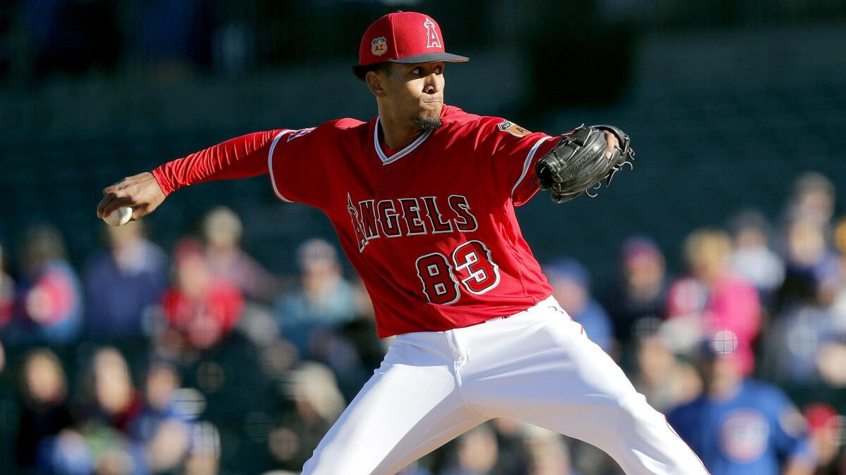 Angels pitcher Keynan Middleton delivers a pitch during a spring training game against the Chicago Cubs.